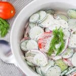 If you're in the mood for a light and refreshing side dish, this Creamy Tomato and Cucumber Salad is just what you need. It's a simple combination of sliced tomatoes, cucumbers, and red onion, all tossed in a creamy, tangy dressing.