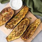 If you're looking for a delicious and healthy side dish, this Grilled Eggplant with Yogurt Sauce is a must-try. The tender, smoky eggplant goes perfectly with the creamy, garlic yogurt sauce, making it the perfect dish to serve with any meal.