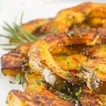 These Roasted Acorn Squash Slices are a super tasty, quick, and easy side dish. With few ingredients and minimal cook/prep time, this fall dish is great as a last-minute addition. The rich flavors of acorn squash are heightened by the aromatic herbs and brought full circle with the addition of parmesan and seasonings.