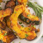 These Roasted Acorn Squash Slices are a super tasty, quick, and easy side dish. With few ingredients and minimal cook/prep time, this fall dish is great as a last-minute addition. The rich flavors of acorn squash are heightened by the aromatic herbs and brought full circle with the addition of parmesan and seasonings.