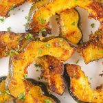These Roasted Acorn Squash Slices are a super tasty, quick, and easy side dish. With few ingredients and minimal cook/prep time, this fall dish is great as a last-minute addition. The rich flavors of acorn squash are heightened by the aromatic herbs and brought full circle with the addition of parmesan and seasonings.