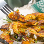 These Roasted Acorn Squash Slices are a super tasty, quick, and easy side dish. With few ingredients and minimal cook/prep time, this fall dish is great as a last-minute addition. The rich flavors of acorn squash are heightened by the aromatic herbs and brought full circle with the addition of parmesan and seasonings.