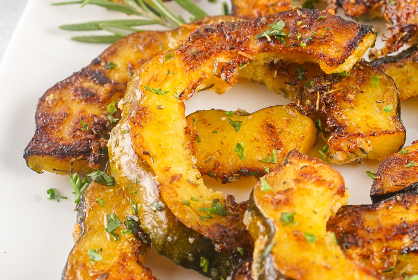 These Roasted Acorn Squash Slices are a super tasty, quick, and easy side dish. With few ingredients and minimal cook/prep time, this fall dish is great as a last-minute addition. The rich flavors of acorn squash are heightened by the aromatic herbs and brought full circle with the addition of parmesan and seasonings.