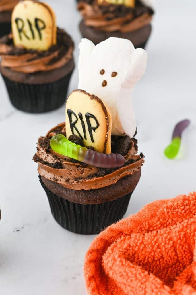 These Halloween Graveyard Cupcakes are a breeze to make, even if you're not a baking wizard. Starting with a box of Devil's Food cake mix means you'll have perfectly moist, chocolatey cupcakes every time. And let's be honest, on busy Halloween nights, we could all use a little shortcut magic!